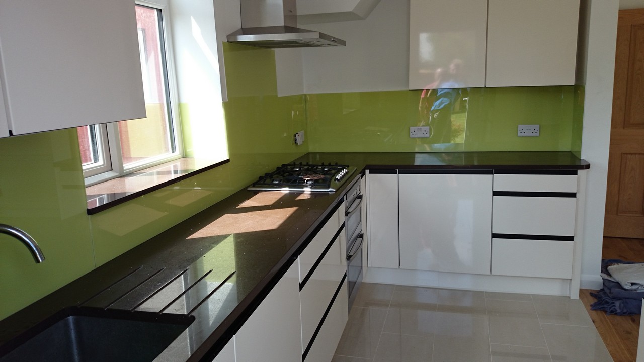 Lime green glass kitchen splashback installed by Tooting glaziers